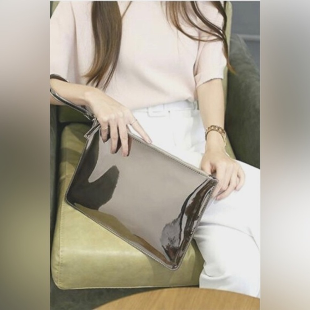 Shiny oversized wristlet